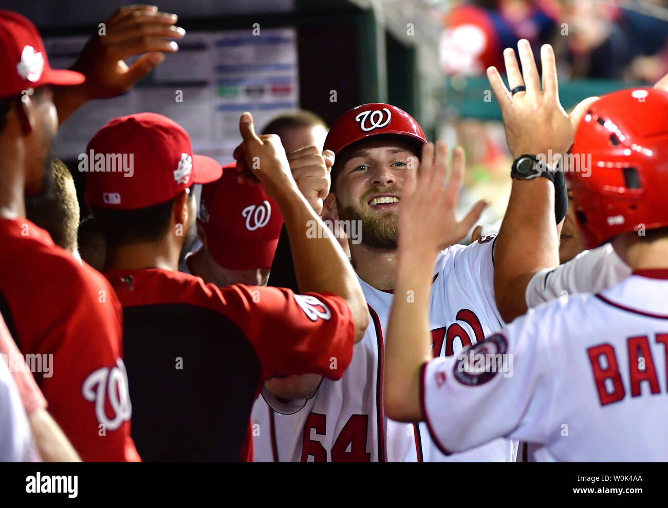 Washington Nationals catcher Spencer Kieboom celebrates in the dugout after scoring off of a single from Trea Turner against the Miami Marlins in the seventh inning at Nationals Park in Washington, D.C. on July 5, 2018. The Washington Nationals defeated the Miami Marlins 14-12. Photo by Kevin Dietsch/UPI Stock Photo