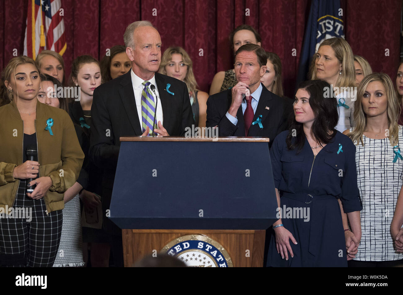 Sen. Jerry Moran, R-KS, (center left) and Sen. Richard Blumenthal, D-CT, speaks alongside victims of convicted child molester and former Team USA Olympic doctor Larry Nassar, during a press conference on abuse within gymnastics and youth sports and the necessary reforms needed to keep young athletes safe, on Capitol Hill in Washington, D.C. on July 24, 2018.   Photo by Kevin Dietsch/UPI Stock Photo