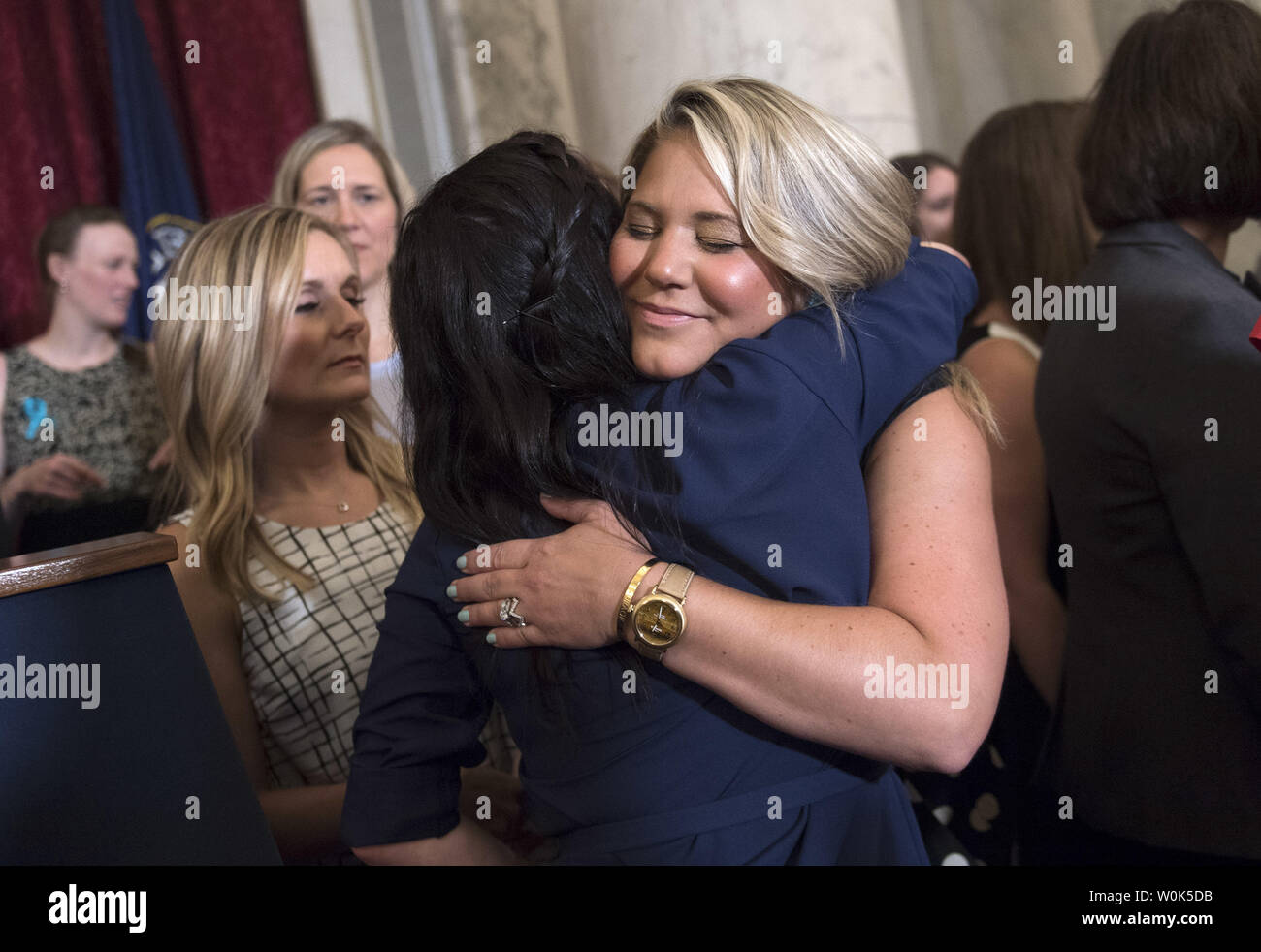 Victims of convicted child molester and former Team USA Olympic doctor Larry Nassar hug prior to a press conference on abuse within gymnastics and youth sports and the necessary reforms needed to keep young athletes safe, on Capitol Hill in Washington, D.C. on July 24, 2018. Photo by Kevin Dietsch/UPI Stock Photo