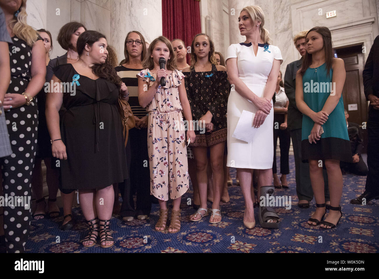 Amy Wagner, 11, gives her name as she stands with fellow victims of convicted child molester and former Team USA Olympic doctor Larry Nassar give their names during a press conference on abuse within gymnastics and youth sports and the necessary reforms needed to keep young athletes safe, on Capitol Hill in Washington, D.C. on July 24, 2018. Photo by Kevin Dietsch/UPI Stock Photo