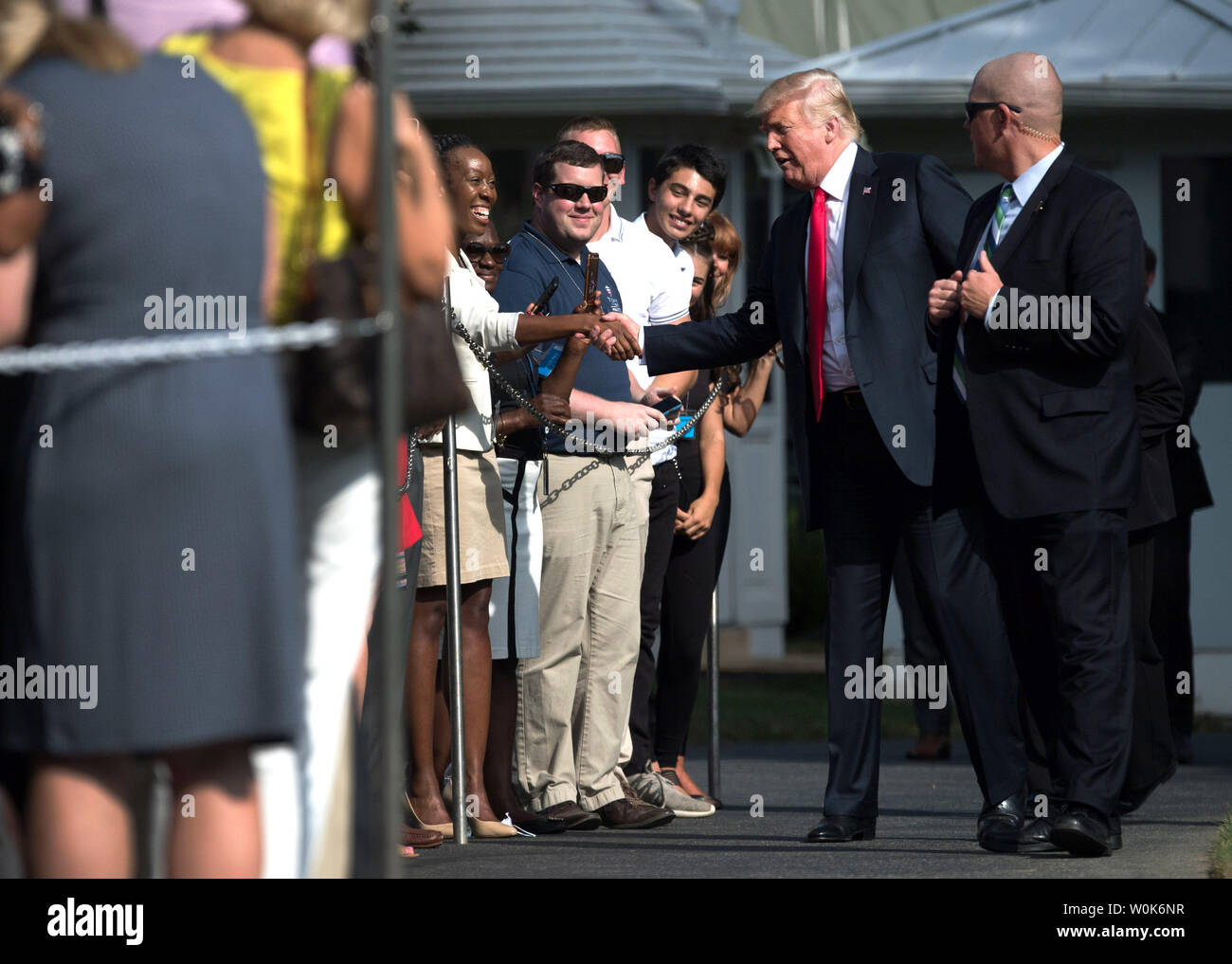 President Donald Trump greets White House guests as he makes his way to Marine One as he travels to Indiana for a rally, on the South Lawn of the White House in Washington, D.C. on August 30, 2018. Photo by Kevin Dietsch/UPI Stock Photo