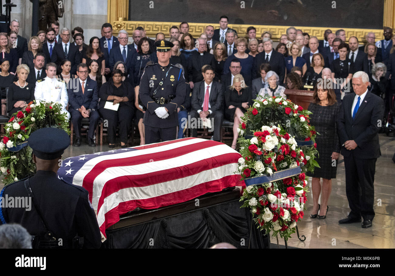 Vice President Mike Pence and wife Karen lay a wreath at the casket of former Senator John McCain as he lies in state at the U.S. Capitol in Washington, DC on Friday, August 31, 2018.  Pence represented the executive branch of government as President Donald Trump was not invited.  McCain, an Arizona Republican, presidential candidate, and war hero, died August 25th at the age of 81. He is the 31st person to lie in state at the Capitol in 166 years.    Photo by Pat Benic/UPI Stock Photo