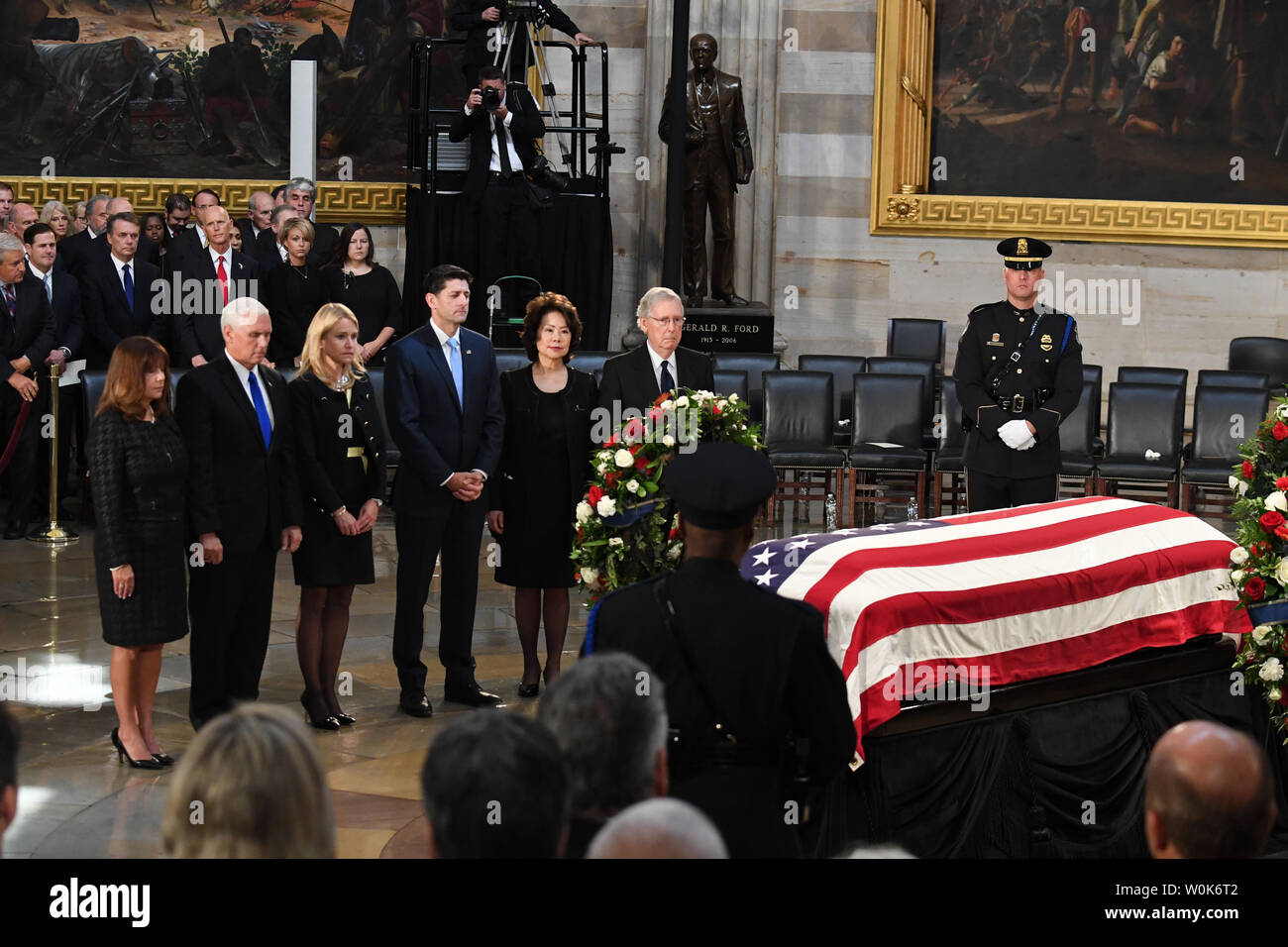 Vice President Mike Pence, Speaker of the House Paul Ryan, and Senate Majority Leader Mitch McConnell and spouses pay their respects by the casket of former Senator John McCain as he lies in state at the U.S. Capitol in Washington, DC on Friday, August 31, 2018.  McCain, an Arizona Republican, presidential candidate, and war hero, died August 25th at the age of 81. He is the 31st person to lie in state at the Capitol in 166 years.    Photo by Pat Benic/UPI Stock Photo