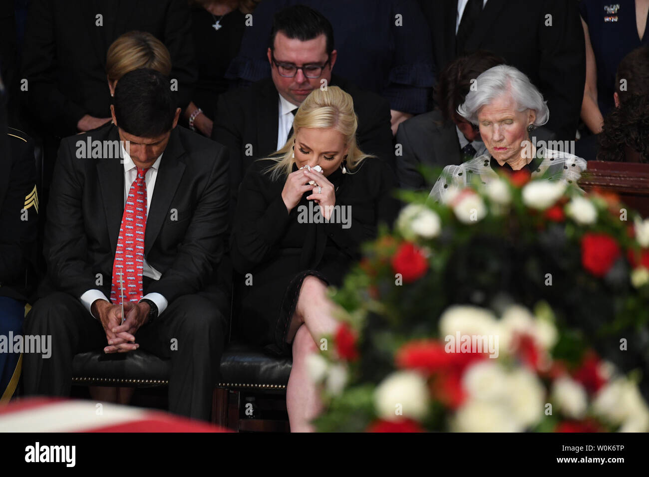 Daughter Meghan McCain and mother Roberta McCain listen during the benediction as the casket of former Senator John McCain lies in state at the U.S. Capitol in Washington, DC on Friday, August 31, 2018.  McCain, an Arizona Republican, presidential candidate, and war hero, died August 25th at the age of 81. He is the 31st person to lie in state at the Capitol in 166 years.    Photo by Pat Benic/UPI Stock Photo