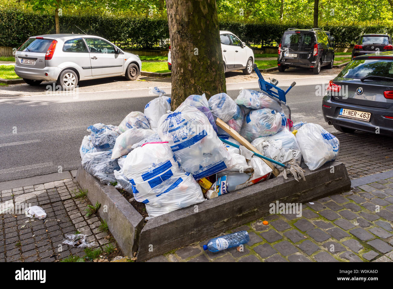 White non-recyclable refuse sacks awaiting collection - Brussels, Belgium. Stock Photo