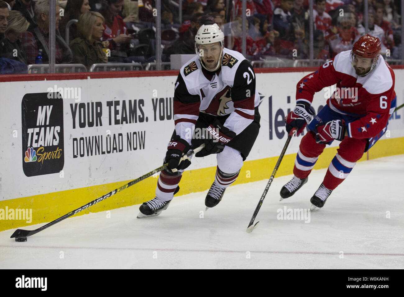 Arizona Coyotes center Derek Stepan (21) carries the puck while defended by Washington Capitals defenseman Michal Kempny (6) during the second period at Capital One Arena on November 11, 2018. The Washington Capitals host the Arizona Coyotes to end a multi-game home stand. Photo by Alex Edelman/UPI Stock Photo