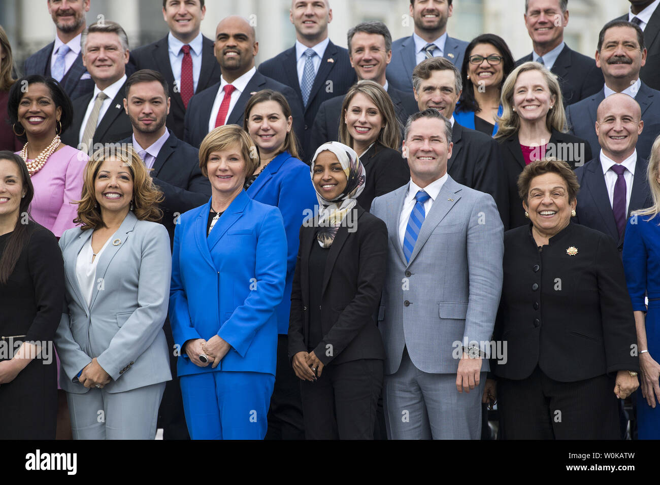 Representative-elect Ilhan Omar, D-MN, (3rd-R) stands with fellow memeber-elects as they pose for the group photo for new members of the upcoming 116th Congress, outside the U.S. Capitol Building in Washington, D.C. on November 14, 2018. Photo by Kevin Dietsch/UPI Stock Photo