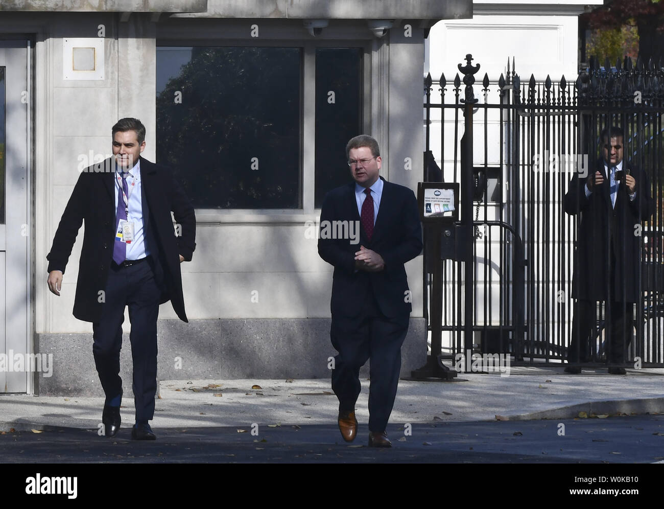 CNN reporter Jim Acosta (L) enters the White House grounds after having his White House press pass reactivated following an decision requiring the White House to immediately return Acosta's press pass by U.S. District Judge Timothy Kelly on November 16, 2018 in Washington, D.C.  CNN's Acosta's press pass was revoked following a recent President Donald Trump press conference.  Photo by Pat Benic/UPI Stock Photo