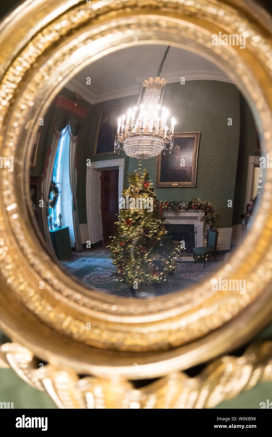 A Mirror In The Green Room Reflects Holiday Decorations In