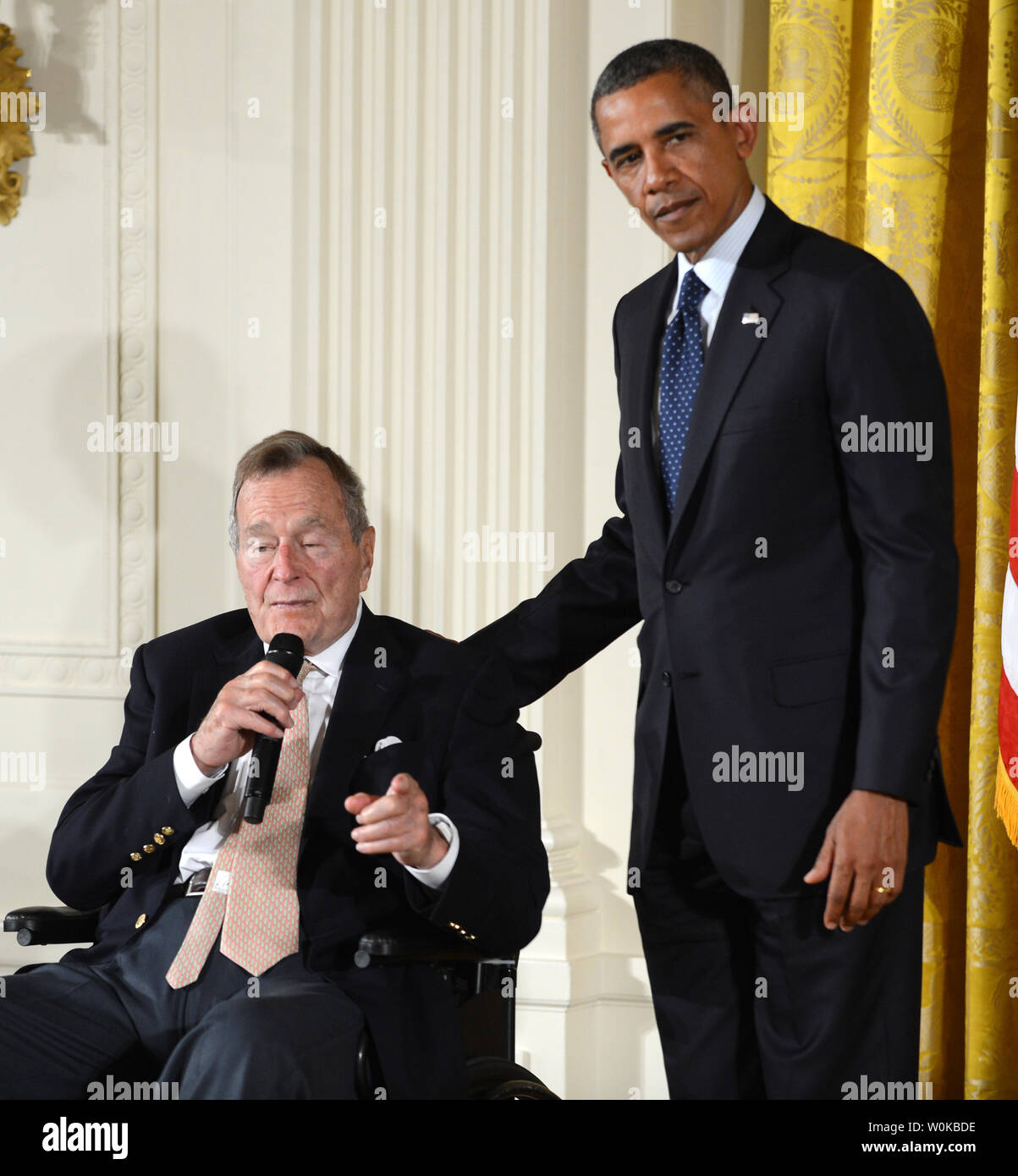 In this file photo, former President George H.W. Bush makes some brief remarks during the presentation of the 5,000th 'Points of Light' Foundation award with President Barack Obama in the East Room of the White House in Washington, DC on July 15, 2013.  George Herbert Walker Bush died November 30, 2018 at the age of 94 years.    UPI/Pat Benic Stock Photo