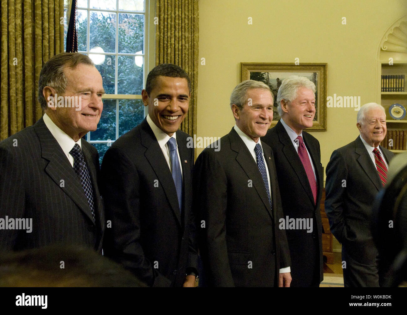 In this file photo, U.S. President George W. Bush (C) welcomes Former President George H.W. Bush (L), President-elect Barack Obama (LC), Former President Bill Clinton (RC) and Former President Jimmy Carter (R) to the Oval Office of the White House in Washington on January 7, 2009. This was the first time all of the living past, present and future Presidents were at the White House together since 1981. George Herbert Walker Bush died November 30, 2018 at the age of 94 years.       Photo by Ron Sachs/UPI Stock Photo