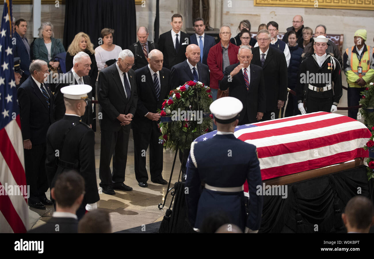 Colin Powell, former secretary of state and general of the first Gulf War (Desert Storm) under former President George H. W. Bush,  views the coffin of the 41st president as he lies in state at the U.S. Capitol Rotunda, in Washington, D.C. on December 4, 2018.  There will be a State Funeral at the National Cathedral on Wednesday, December 5, 2018.   Photo by Pat Benic/UPI Stock Photo