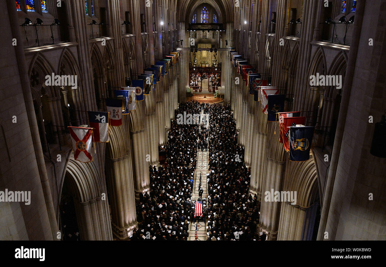 The casket containing the remains of President George H.W. Bush departs the National Cathedral following his funeral service, in Washington D.C. on December 5, 2018. Photo by Kevin Dietsch/UPI Stock Photo