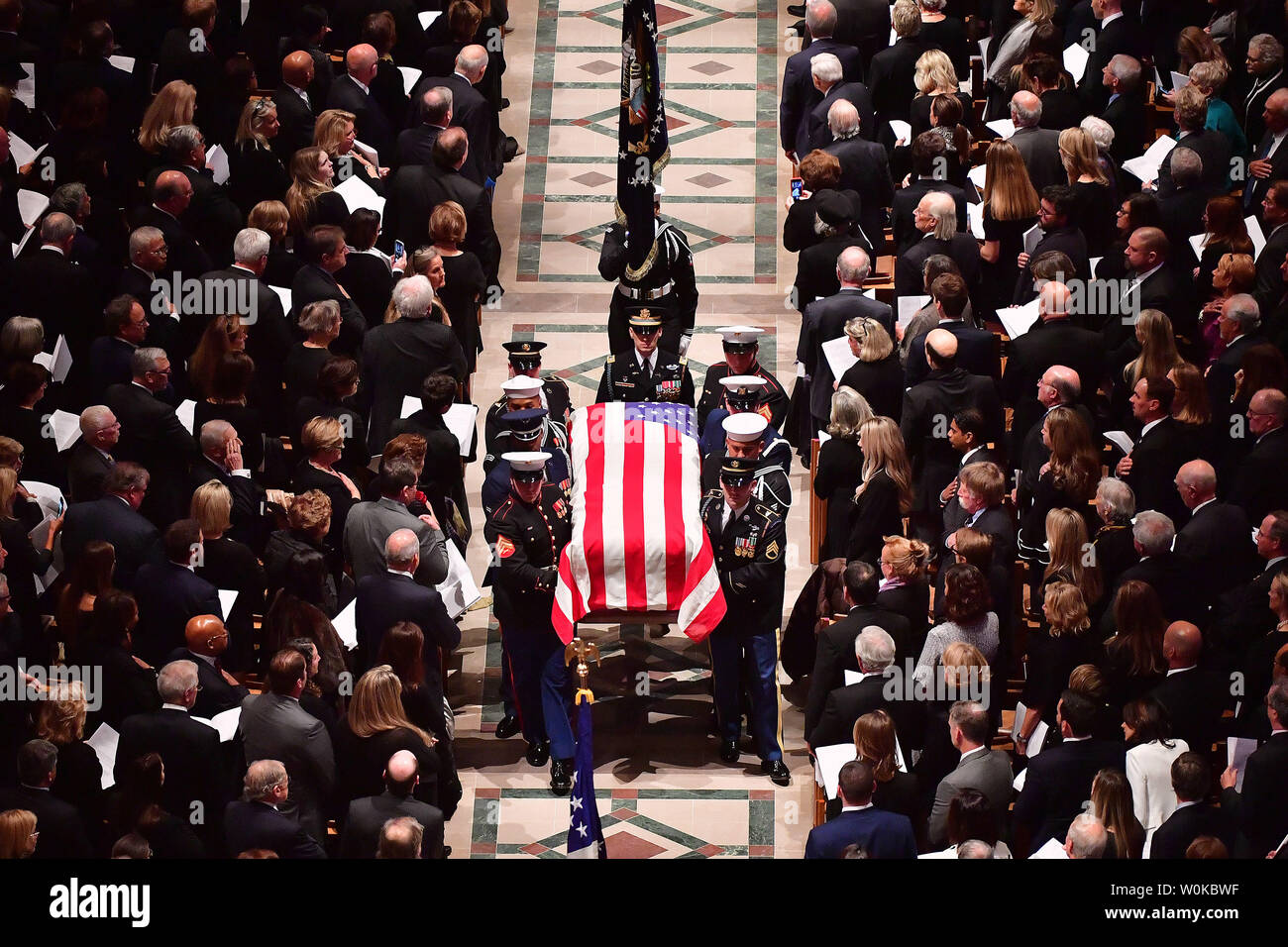 The casket containing the remains of President George H.W. Bush departs the National Cathedral following his funeral service, in Washington D.C. on December 5, 2018. Photo by Kevin Dietsch/UPI Stock Photo