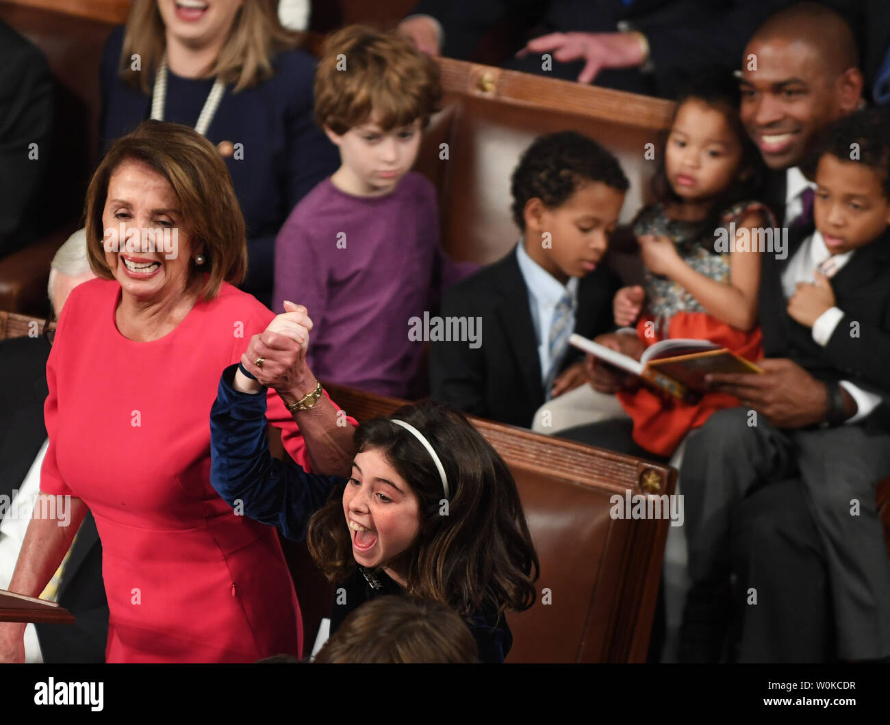 Newly-elected Speaker of the House Nancy Pelosi holds the hand of granddaughter Bella Kaufmann Pelosi as she jumps in joy after it was announced her grandmother was elected in the  House Chamber during the 116th Congress  at the U.S. Capitol in Washington, DC on January 3, 2019.  At right is Rep. Antonio Delgado, D-NY, with his family. Pelosi  became the first official to return to that position since Sam Rayburn in 1955.      Photo by Pat Benic/UPI Stock Photo