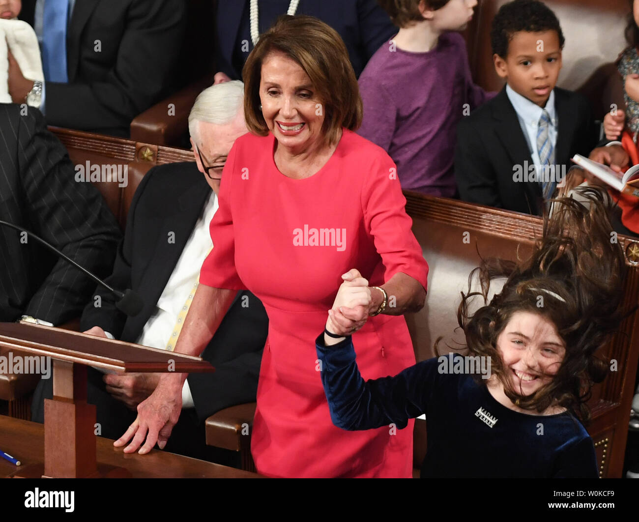 Congresswoman Nancy Pelosi (D-CA) casts her vote for herself as Speaker of the House as her granddaughter (R) Bella Kaufmann Pelosi jumps and yells at the 116th U.S. Congress in the House Chamber on Capitol Hill in Washington, DC on January 3, 2019. Pelosi, 52nd Speaker of the House, became the first official to return to that position since Sam Rayburn in 1955.   Photo by Pat Benic/UPI Stock Photo
