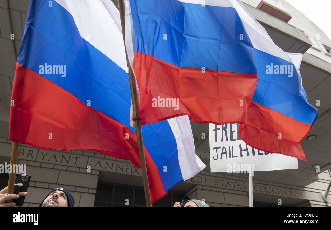 Pro Trump and Stone supporters wave Russian Flags and play the Russian National Anthem outside federal court as former President Donald Trump's adviser Roger Stone is arraigned in Washington, DC on January 29, 2019.  Sone is charged with witness tampering, false statements and obstruction of official proceedings.   Photo by Pat Benic/UPI Stock Photo