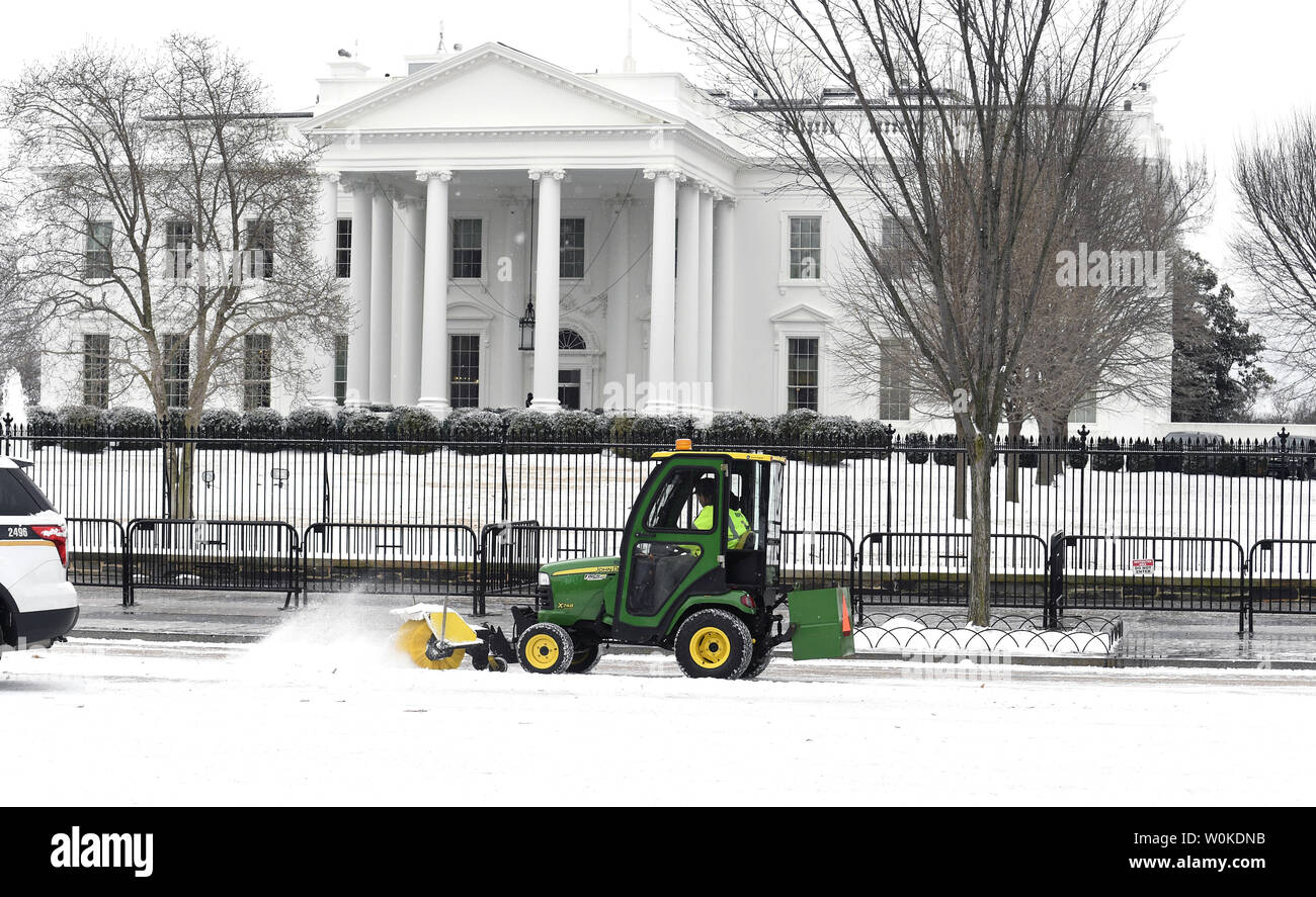 A snow plow moves along Pennsylvania Avenue in front of the White House after a dusting of snow, Washington, DC, February 1, 2019. A polar vortex across much of North Central and Eastern United States is blamed for at least 21 deaths.   Photo by Mike Theiler/UPI Stock Photo