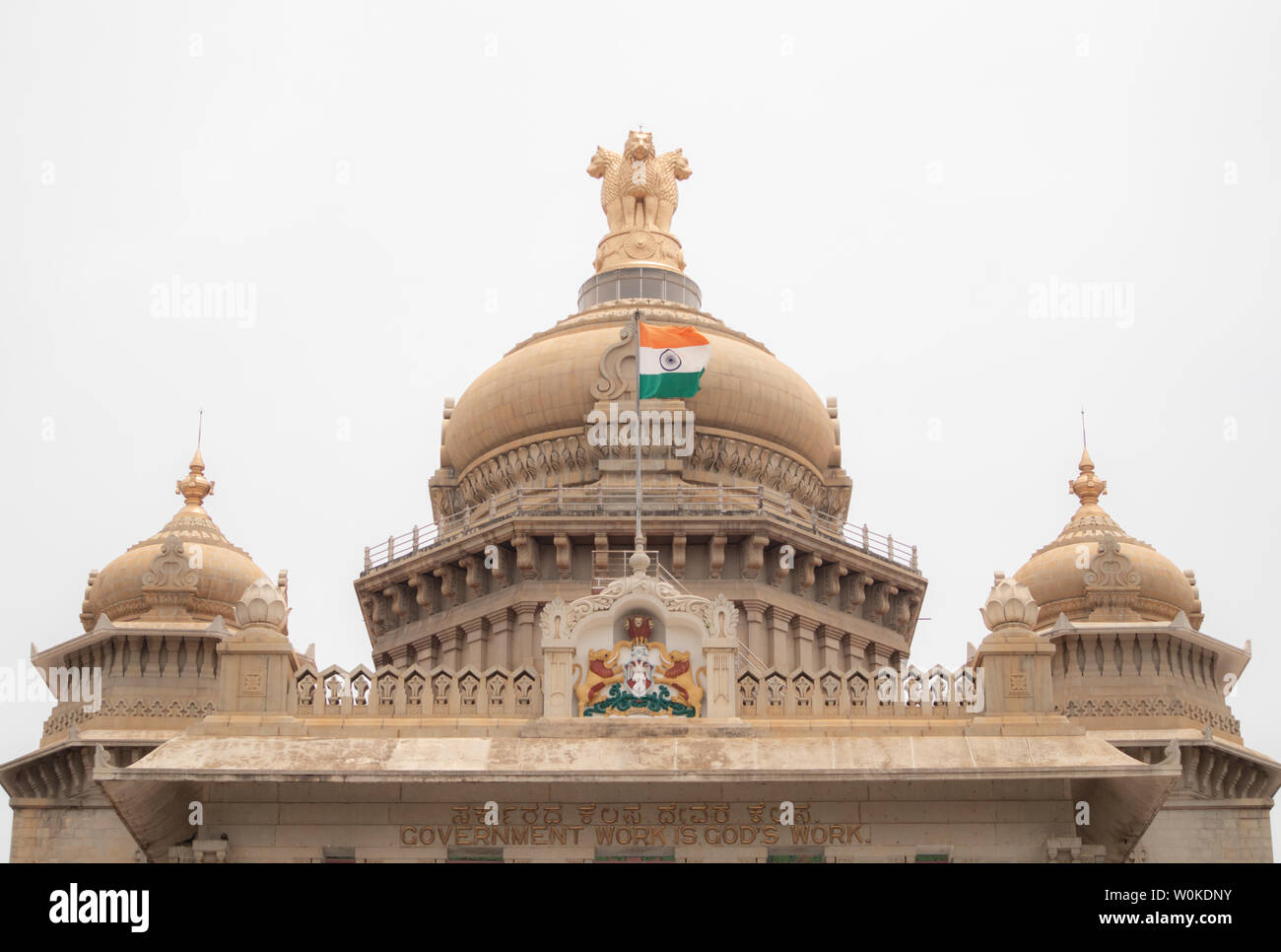 Indian Flag waving on the dome of Vidhana Soudha at Bangaluru, India. Stock Photo