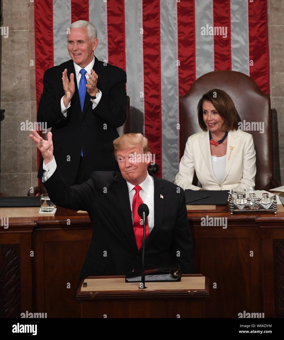 President Donald Trump delivers his State of the Union address to a joint session of Congress in the House Chamber of the U.S. Capitol in Washington, DC on February 5, 2019. Vice President Mike Pence stands applauding while Speaker of the House Nancy Pelosi remains seated. Photo by Pat Benic/UPI Stock Photo