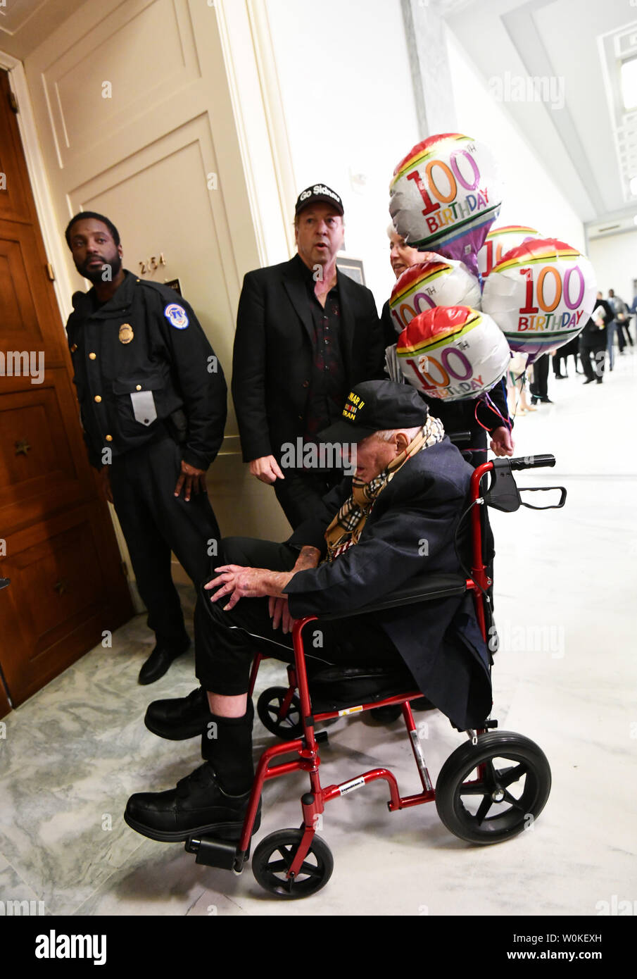 A 100 year old man waits to enter the room where Michael D. Cohen will testify before the House Oversight Committee on February 27, 2019 in Washington DC. Cohen, once one of President Trump's most trusted aides and lawyers, took the witness stand for his first and only public appearance before Congress on Wednesday to discuss the President's personal character and possible criminal conduct.      Photo by Pat Benic/UPI Stock Photo