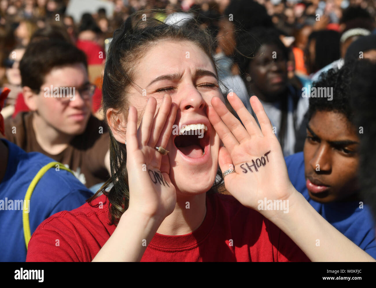 A young woman shouts as students from  the Washington, DC area stage a walkout and march in protest of gun violence in Washington, DC on March 14, 2019. The group rallied at the White House and marched to the Capitol.               Photo by Pat Benic/UPI Stock Photo