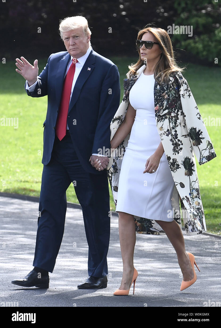President Donald Trump and First Lady Melania Trump walk hand-in-hand to  Marine One for departure from the White House, April 18, 2019, Washington,  DC. The Trumps will spend Easter weekend at the