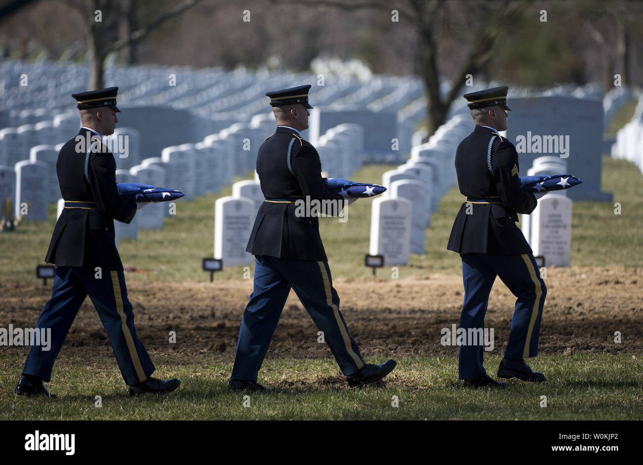 Members of an Army Honor Guard with the Army's 3rd Infantry Regiment (The Old Guard) carry flags during a funeral service for U.S. Army Sgt. First Class Matthew Q. McClintock, at Arlington National Cemetery in Arlington, Virginia on March 7, 2015. SFC McClintock, a U.S. Army Special Forces soldier, was killed in action on Tuesday, January 5, 2016, in Afghanistan. Photo by Kevin Dietsch/UPI Stock Photo