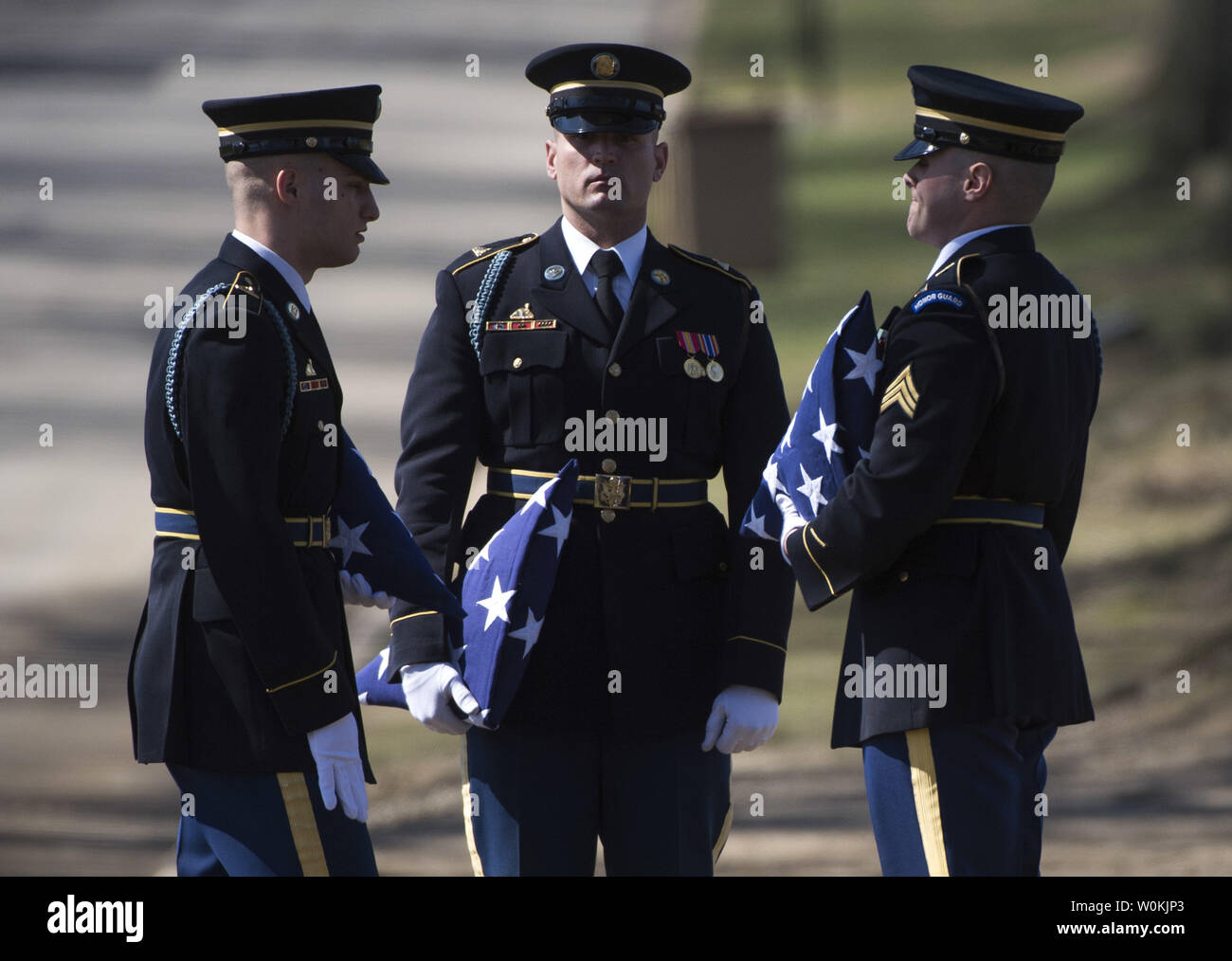 Members of an Army Honor Guard with the Army's 3rd Infantry Regiment (The Old Guard) hold flags during a funeral service for U.S. Army Sgt. First Class Matthew Q. McClintock, at Arlington National Cemetery in Arlington, Virginia on March 7, 2015. SFC McClintock, a U.S. Army Special Forces soldier, was killed in action on Tuesday, January 5, 2016, in Afghanistan. Photo by Kevin Dietsch/UPI Stock Photo