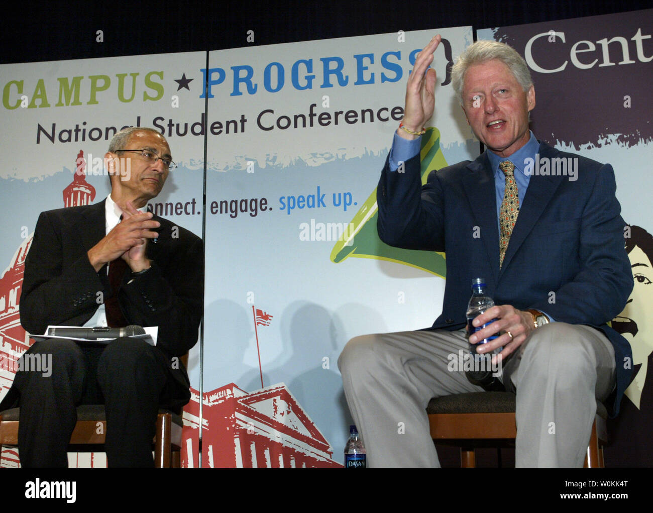 John Podesta, president and CEO of the Center for American Progress, (L) applauds former U.S. President Bill Clinton at the Progress National Student Conference in Washington, July 13, 2005. (UPI Photo/Yuri Gripas) Stock Photo