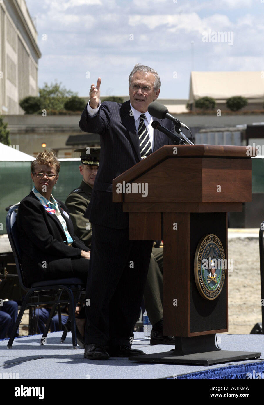 U.S. Defense Secretary Donald H. Rumsfeld gestures during remarks at the 9/11 Memorial ground-breaking ceremony outside of the Pentagon in Washington on June 15, 2006. The Pentagon Memorial will commemorate the 184 innocent lives lost in the Pentagon and on American Airlines Flight 77 on September 11, 2001. (UPI Photo/Yuri Gripas) Stock Photo
