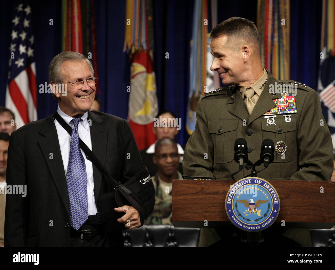 U.S. Defense Secretary Donald Rumsfeld (L) smiles to General Peter Pace, Chairman of the Joint Chiefs of Staff, as he speaks  at the Pentagon Town Hall meeting in Washington, September 22, 2006.  (UPI Photo/Yuri Gripas) Stock Photo