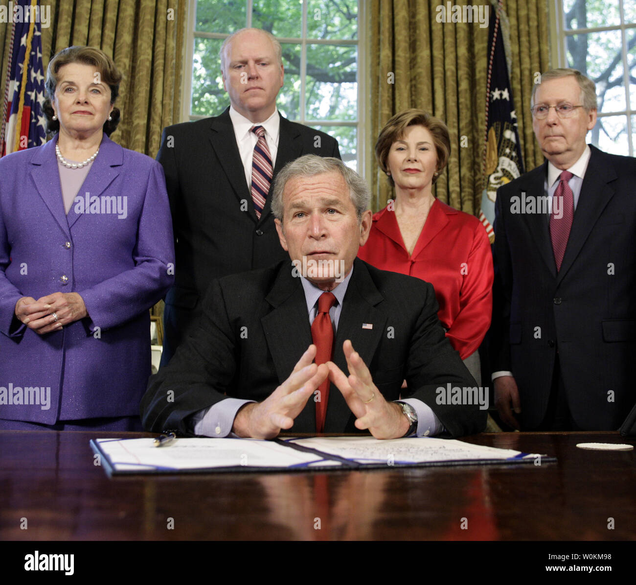 U.S. President George W. Bush speaks after signing H.R. 4286, bestowing the  Congressional Gold Medal in absentia to Nobel laureate Daw Aung San Suu Kyi  in the Oval Office of the White