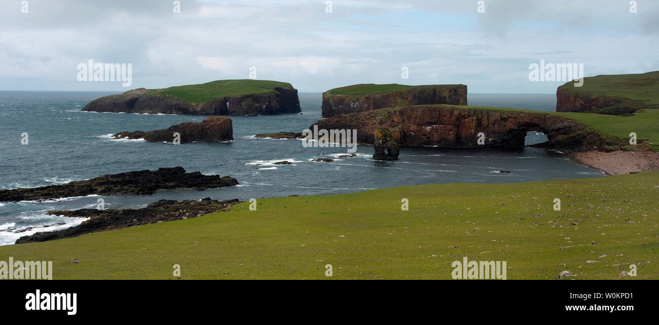 Lyra skerry, Fogla skerry and natural arch, NW Papa Stour, Shetland Stock Photo