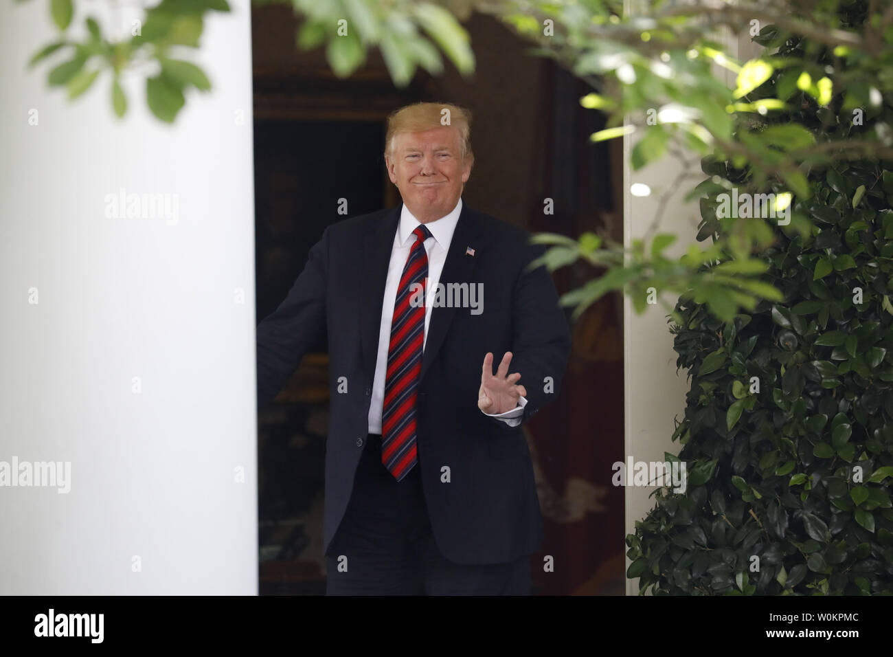 U.S. President Donald Trump walks out from the Oval Office to deliver ...