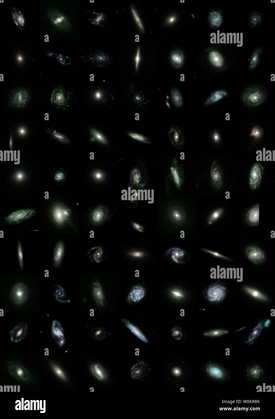 This Hubble Space Telescope mosaic of 80 bright galaxies from the GEMS survey, and illustrates the diversity of different galaxy shapes, sizes and types: watermelon-shaped elliptical galaxies, majestic spiral galaxies, some with elongated bars in their centers, and spectacular galaxy mergers.  The mosaic looks nine billion years into the past, when the universe was just one-third its current age. The GEMS survey stands for Galaxy Evolution from Morphology and Spectral energy distribution, and is aimed at better understanding the nature of galaxies.   (UPI Photo/Hubble/GEMS) Stock Photo