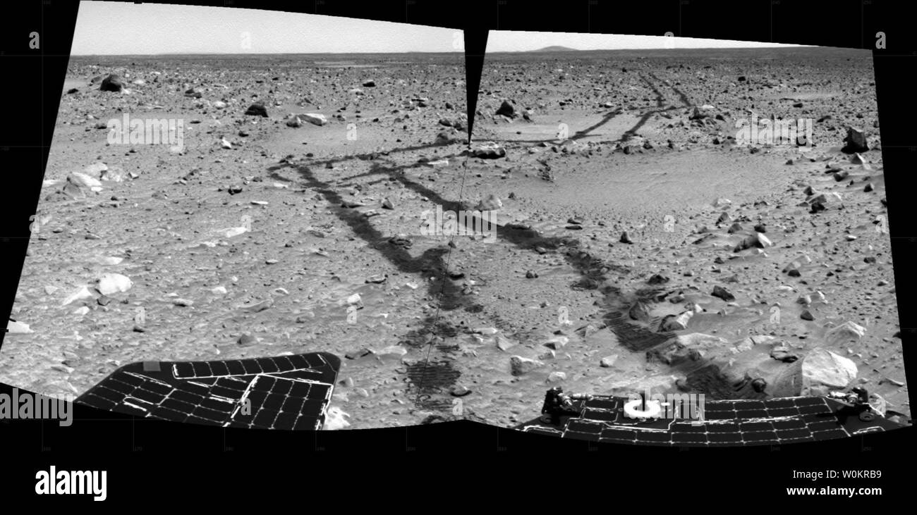 This pair of pieced-together images from Spirit's rear navigation camera  reveals a long and rocky path of nearly 240 meters (787 feet) the rover  drove from its landing site at Gusev Crater.