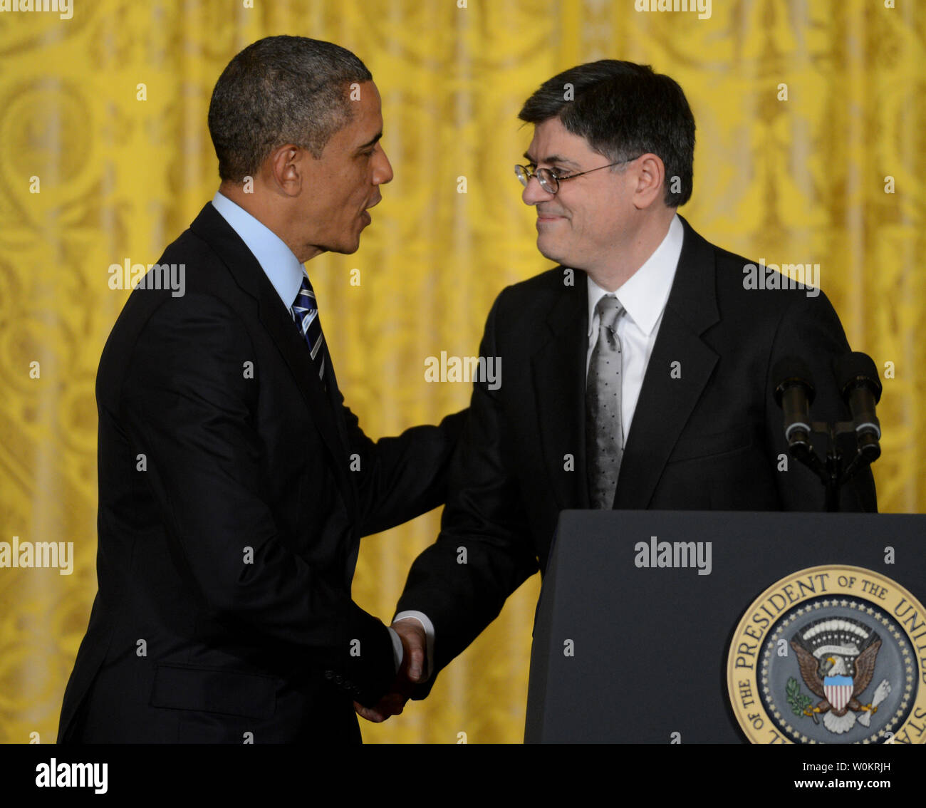 President Barack Obama shakes hands with Jack Lew who had just been noiminated as the new Treasury Secretary replacing Tim Geithner in the East Room of the White House in Washington, DC on January 10, 2013.    UPI/Pat Benic Stock Photo