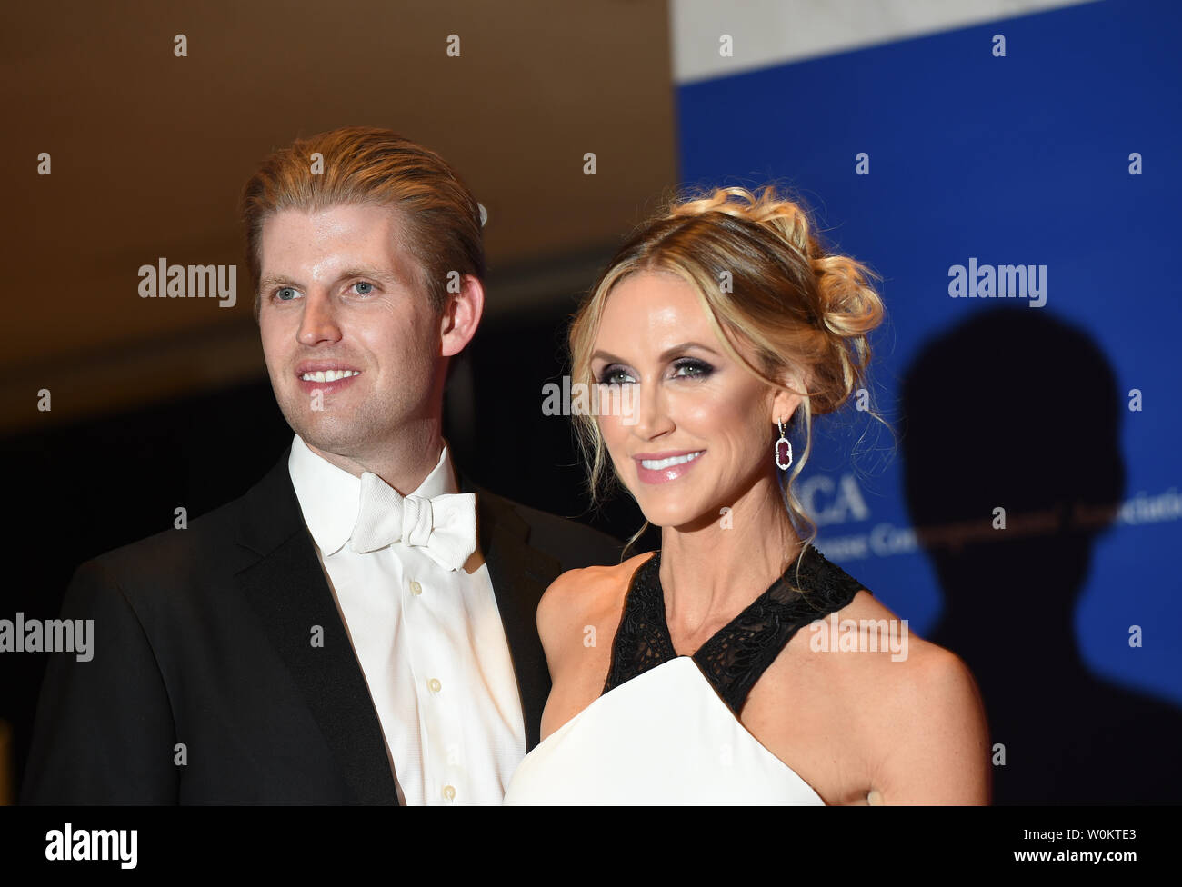 Eric Trump and his wife Lara Yunaska pose on the red carpet prior to