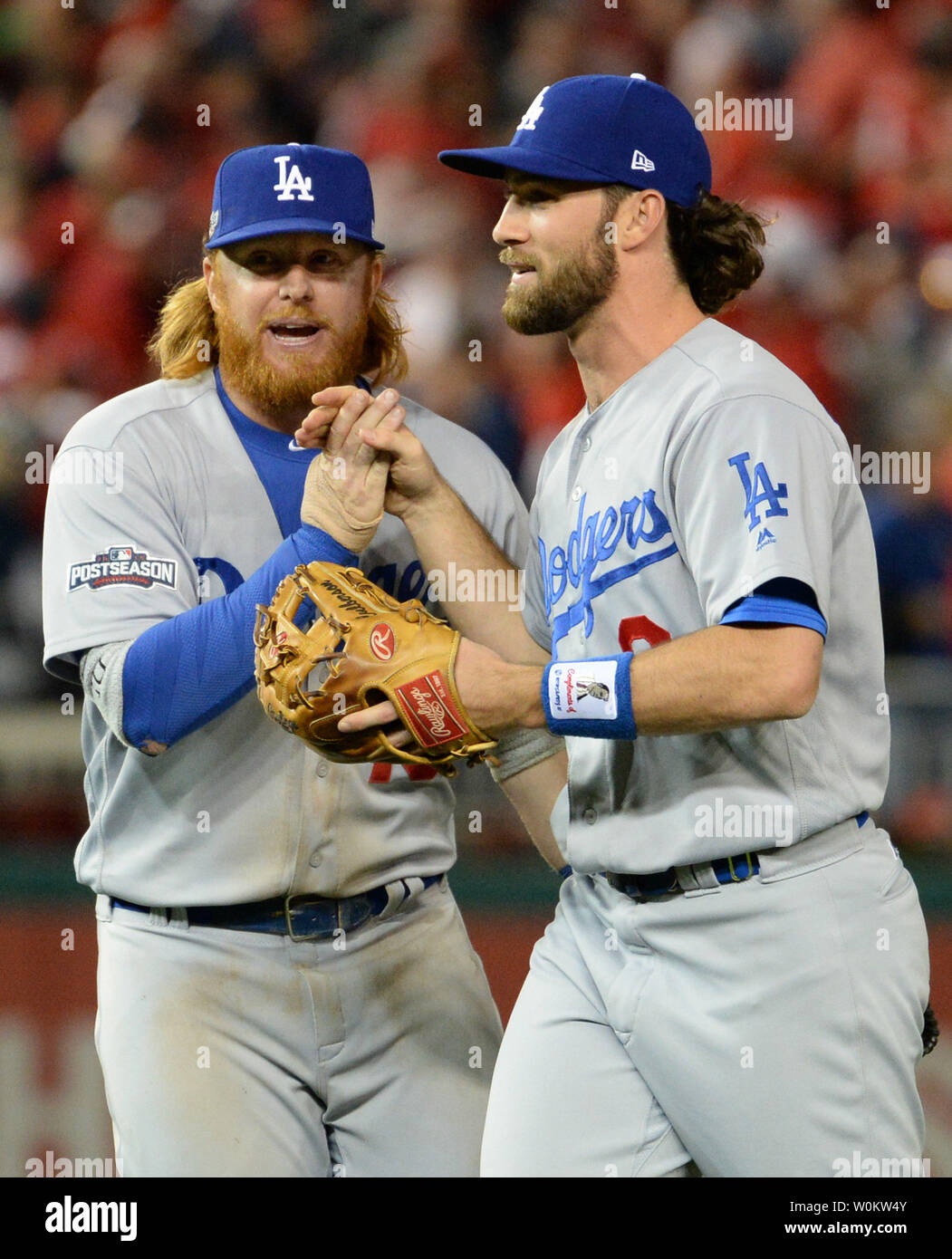 Los Angeles Dodgers' Justin Turner (L), who had a 2-RBI homer, and Charlie  Culberson celebrate the 4-3 win over the Washington Nationals in game 1 of  the National League Division Series in