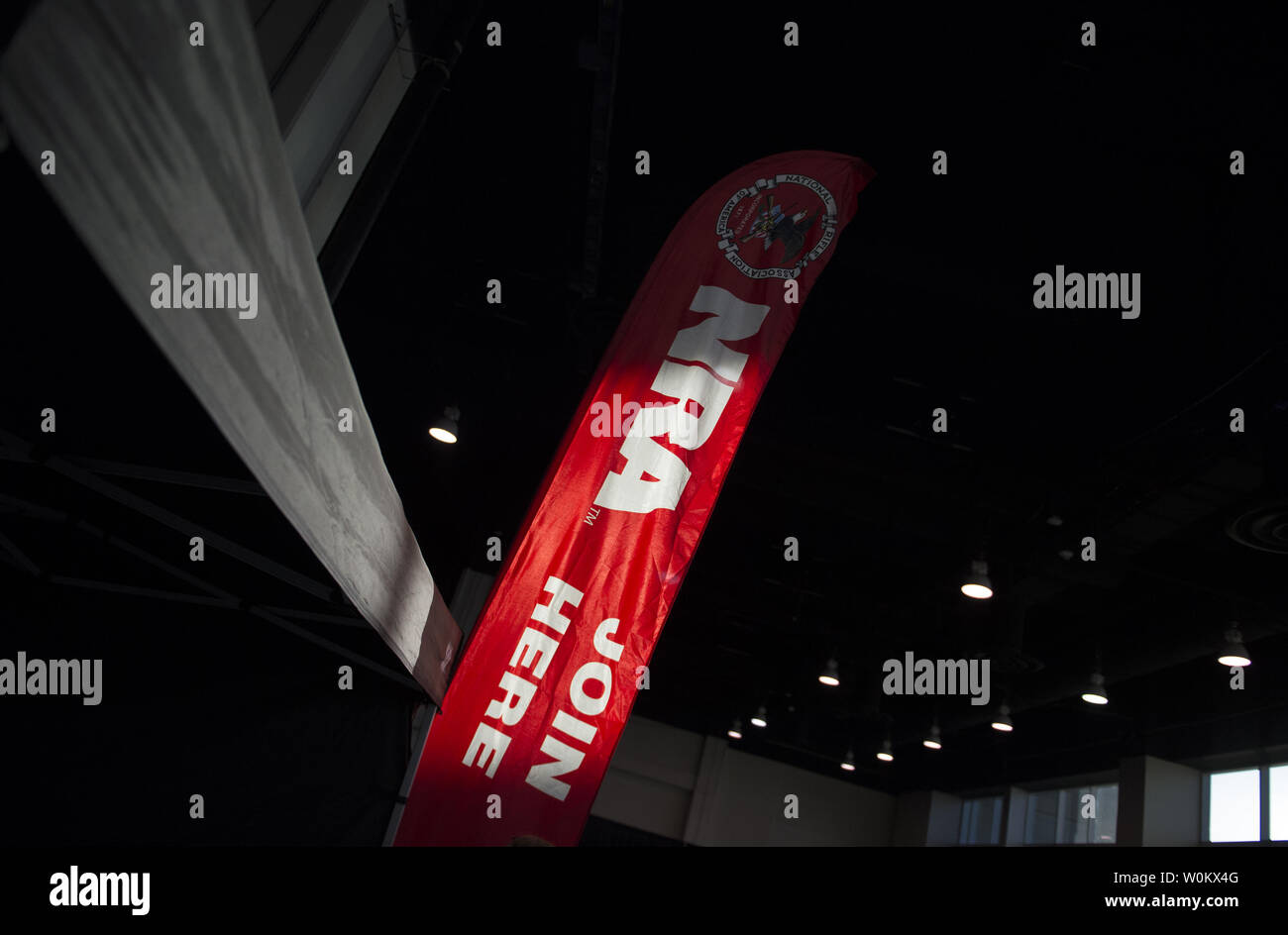 An NRA sign is displayed in the exhibit area of the Conservative ...
