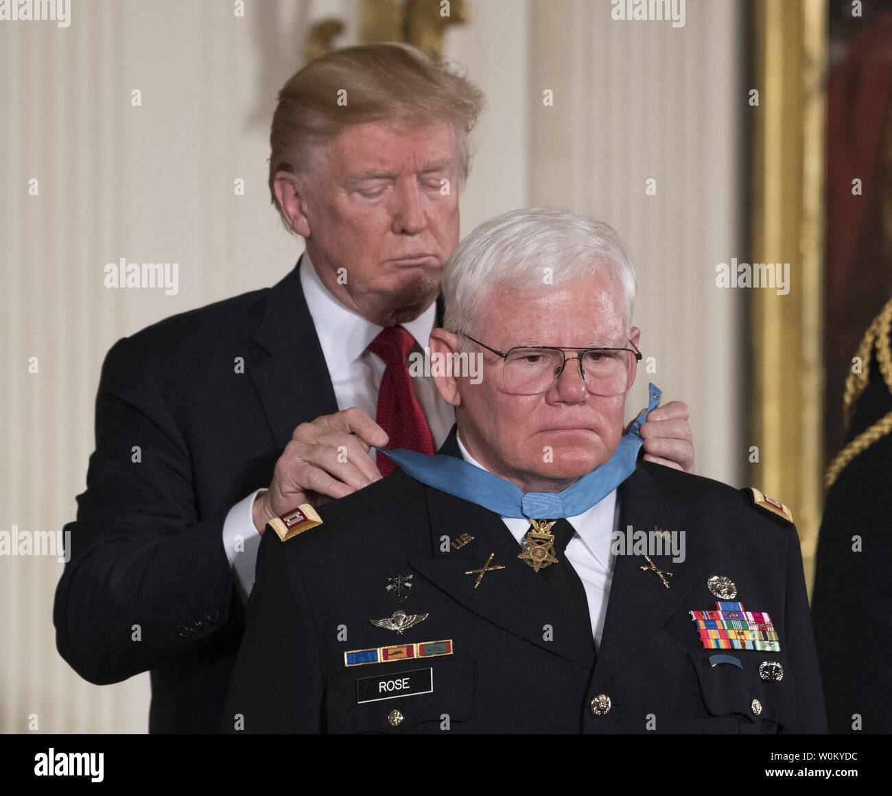 U.S. President Donald Trump presents the Medal of Honor to Retired Army Capt. Gary Michael Rose during ceremony in the East Room of the White House in Washington, DC on October 23, 2017.   Rose was a special forces medic who saved numerous lives on a secret mission to Laos during the Vietnam War.     Photo by Pat Benic/UPI Stock Photo