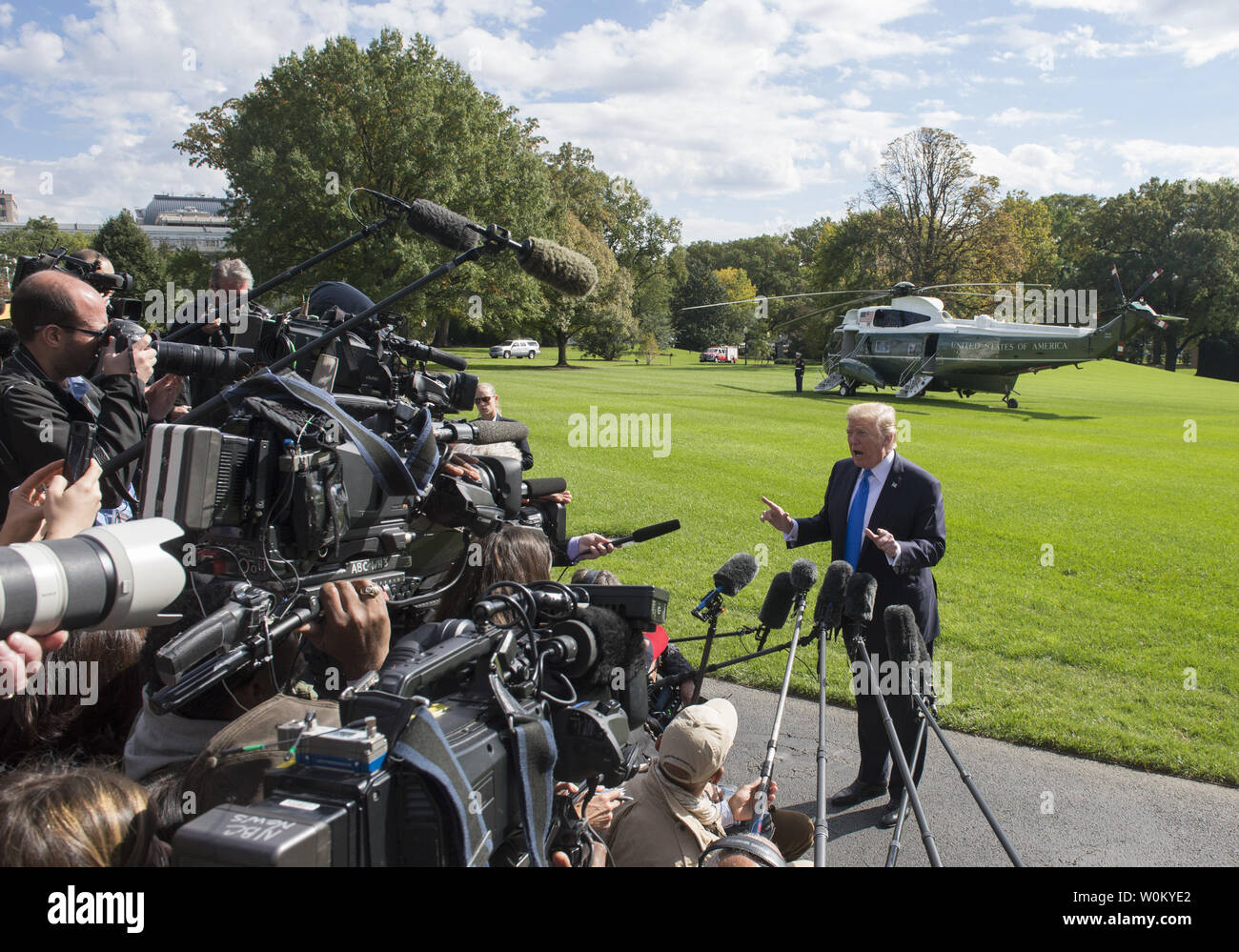 https://c8.alamy.com/comp/W0KYE2/us-president-donald-trump-answers-a-reporters-question-during-an-impromptu-press-conference-on-the-south-lawn-as-he-walks-from-the-oval-office-to-marine-one-to-depart-the-white-house-in-washington-dc-on-october-25-2017-the-president-answered-a-wide-range-of-questions-and-will-be-visiting-texas-today-photo-by-pat-benicupi-W0KYE2.jpg
