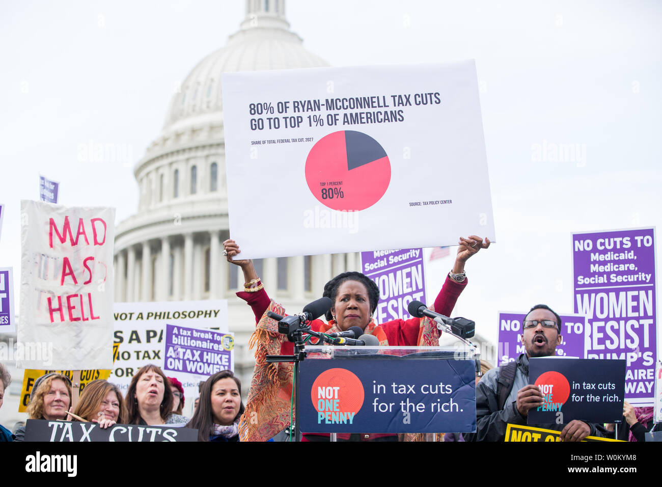 Rep. Sheila Jackson Lee (D-TX) holds up a sign that states '80% of Ryan-McConnell tax cuts go to the top 1% of americans' while speaking at a rally against the Trump tax plan organized by The Patriotic Millionaires on Capitol Hill in Washington, DC on November 1, 2017.     Photo by Erin Schaff/UPI Stock Photo