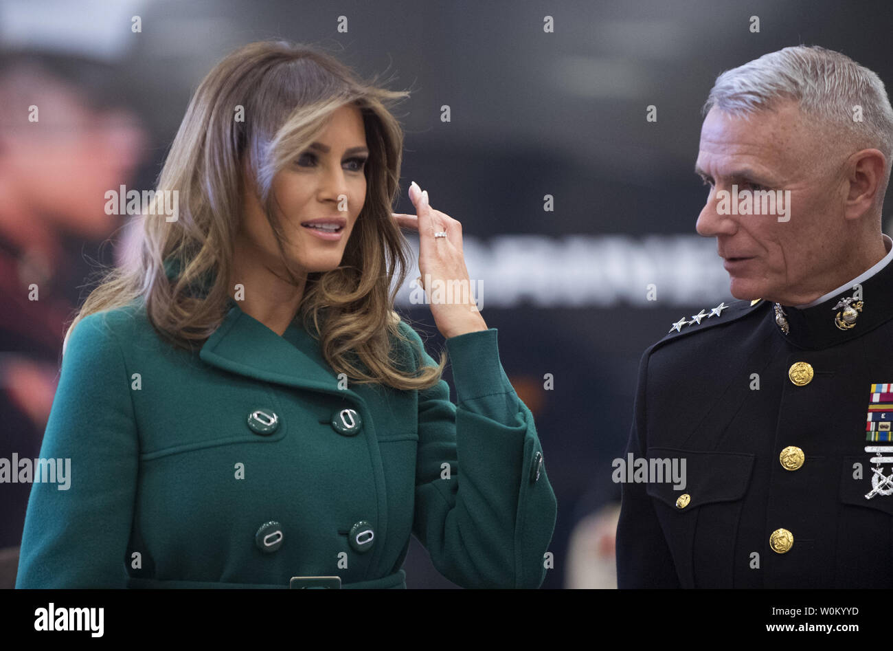 First Lady Melania Trump talks with Lt. Gen. Rex McMillan as he helps children with the Marine Corps Reserve Toys for Tots Campaign at Joint Base Anacostia-Bolling in Washington, DC on December 13, 2017.  The first lady helped sort and box toys at the base with military children to help other children in the DC area.   Photo by Pat Benic/UPI Stock Photo