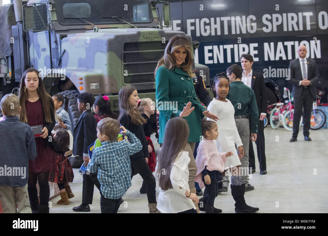 First Lady Melania Trump helps children as they participate in the Marine Corps Reserve Toys for Tots Campaign at Joint Base Anacostia-Bolling in Washington, DC on December 13, 2017.  The first lady helped write holiday cards, sort and box toys at the base with military children to help other children in the DC area.   Photo by Pat Benic/UPI Stock Photo