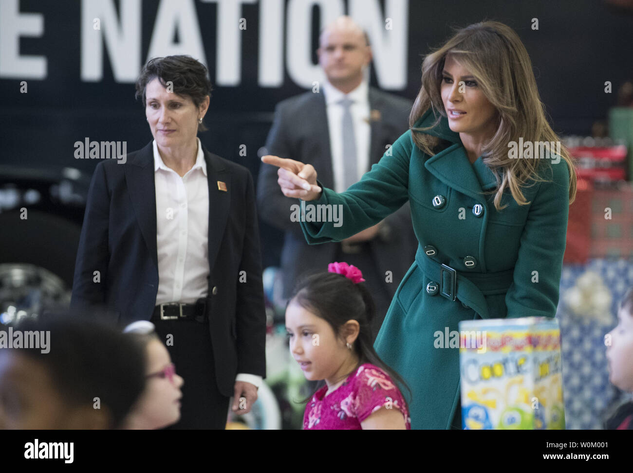 First Lady Melania Trump helps children as they participate in the Marine Corps Reserve Toys for Tots Campaign at Joint Base Anacostia-Bolling in Washington, DC on December 13, 2017.  The first lady helped write holiday cards, sort and box toys at the base with military children to help other children in the DC area.   Photo by Pat Benic/UPI Stock Photo