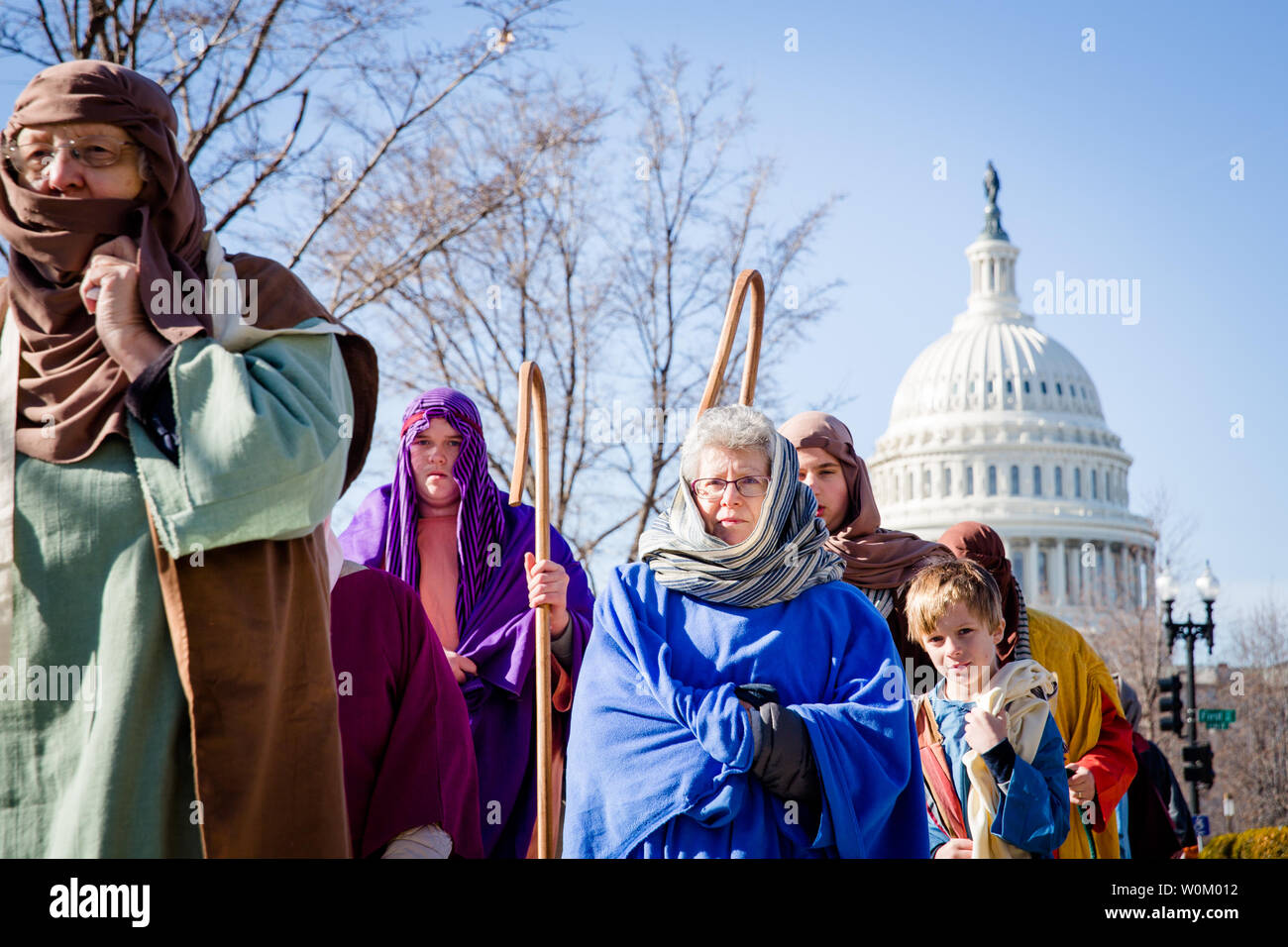Actors portraying shepherds walk past the Capitol building during Faith ...