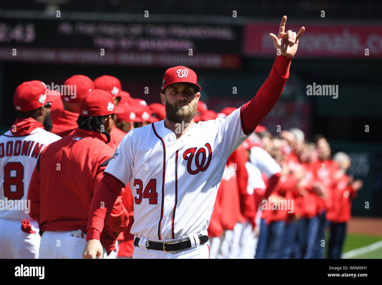 Washington Nationals Bryce Harper waves to the crowd as he is introduced  prior to Nats home opener against the New York Mets at Nationals Park in  Washington, DC on April 5, 2018.