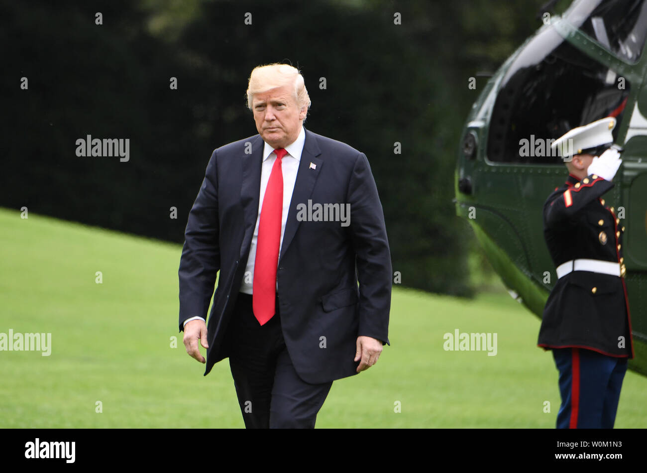 President Donald Trump walks to his residence as he arrives via Marine One on the South Lawn of the White House in Washington, DC on September 27, 2018.   The president is returning from New York and the United Nations.   Photo by Pat Benic/UPI Stock Photo